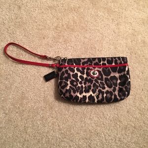 Coach wristlet leopard print with red trim